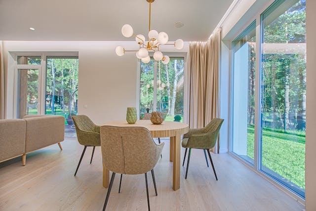 A dining room with a lot of natural light.