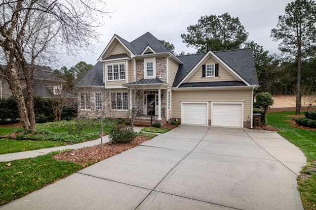 A house with a large driveway.