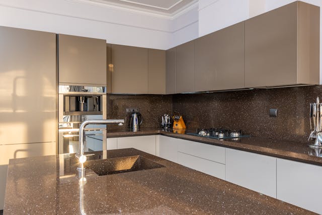 A kitchen with modern countertops.