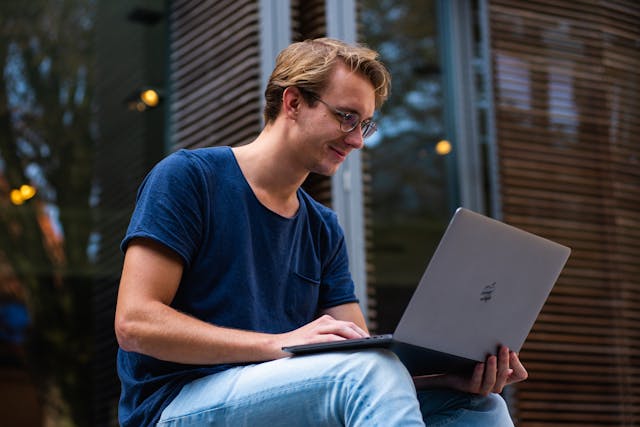 A person on a laptop.