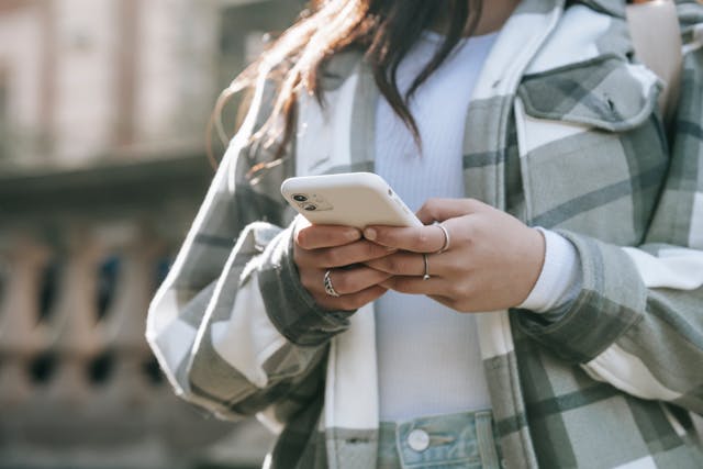 A person texting on their smartphone